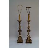 A pair of Spanish or Italian silvered wood ecclesiastical candlesticks, late 19th/20th century,