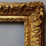 A French Carved and Gilded Louis XIV Frame, late 17th/early 18th century, with schematic leaf sight,