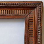 An Italian Carved Nutwood Frame, early 19th century, with cavetto sight, beaded course,