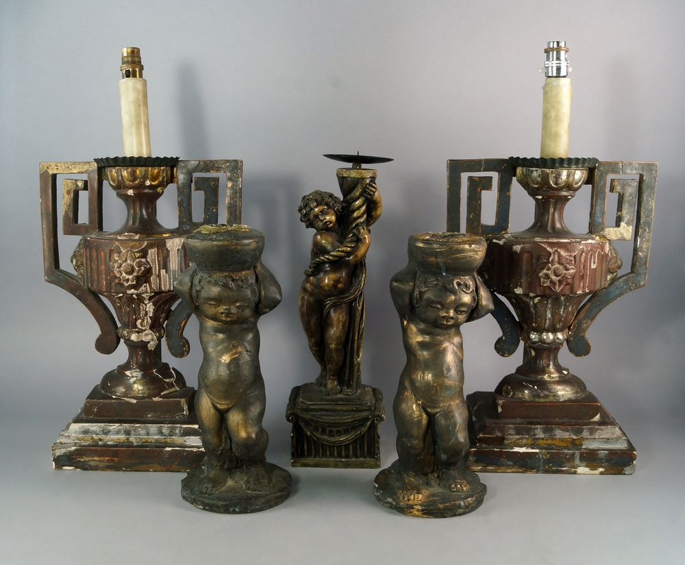 A pair of Italian painted gesso and carved wood candlesticks, 19th century, modeled as urns on