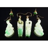 A pair of yellow metal and jade earrings, 20th century, in the form of bats,