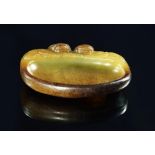 A Chinese carved yellow and russet jade twin dragon brush washer, of rounded rectangular form,