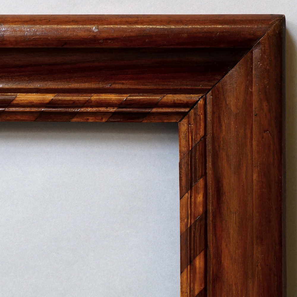 A Pair of Dutch Nutwood Frames, early 19th century, each with raked marquetry and cavetto sight,
