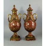 A pair of French rouge guillot and gilt metal mounted side urns, 19th century, with acorn finials to