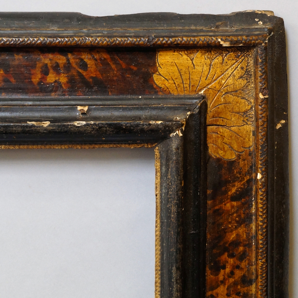 A Tuscan Painted, Ebonised and Parcel Gilded Cassetta Frame, 17th century, with hazzle sight, ogee, - Image 2 of 2