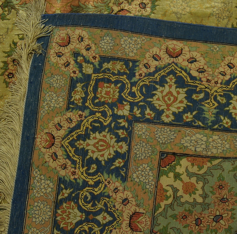 A Ghom silk rug, late 20th Century, with medallion in fawn coloured field within main blue border - Image 2 of 2