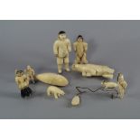 A group of Inuit walrus ivory figures, 20th century, to comprise various hunters, polar bears and