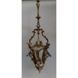 A French taste gilt metal hall lantern, 20th century, the frame of three panel form with scrolling