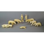 A group of Inuit walrus ivory animals, 20th century, to comprise models of polar bears in various