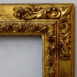 A Spanish Carved and Gilded Frame, 17th century, with cavetto sight, centre tied fruit and leaf,