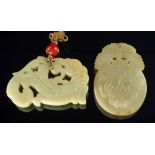 A Chinese carved pale green jade plaque, of oval form and decorated with foliage, 7cm high,