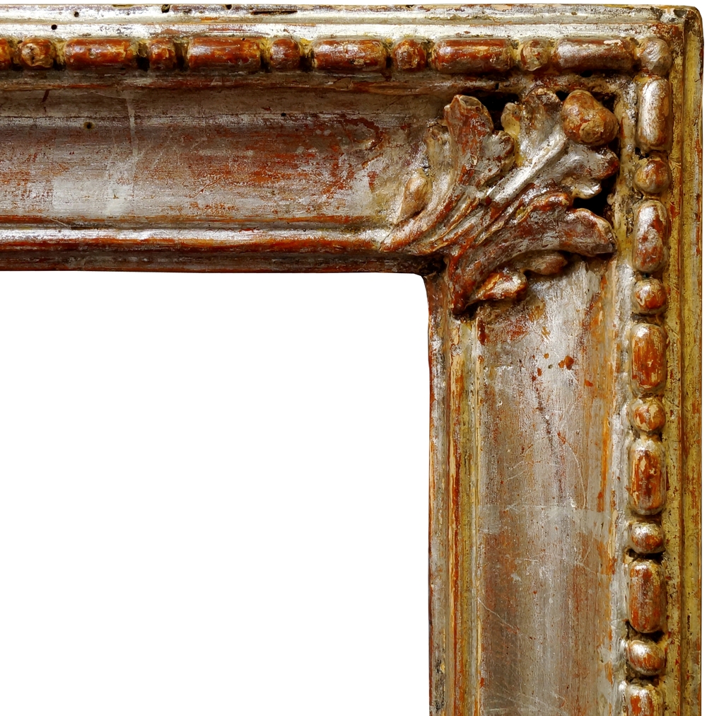 An Italian Carved and Silvered Frame, 18th century, with cavetto sight,