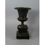 A French campana bronze urn, 19th century, the body applied with wreaths and classical figures, on a