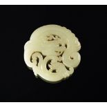 A Chinese carved white jade dragon pendant, of circular and pierced form, 6cm diam.