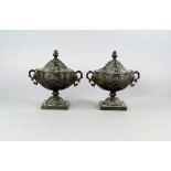 A pair of French bronze oval vases and covers, 19th century, overall moulded with foliate designs,