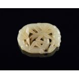 A Chinese carved pale green jade bamboo plaque, of oval form and pierced and flowering decoration,