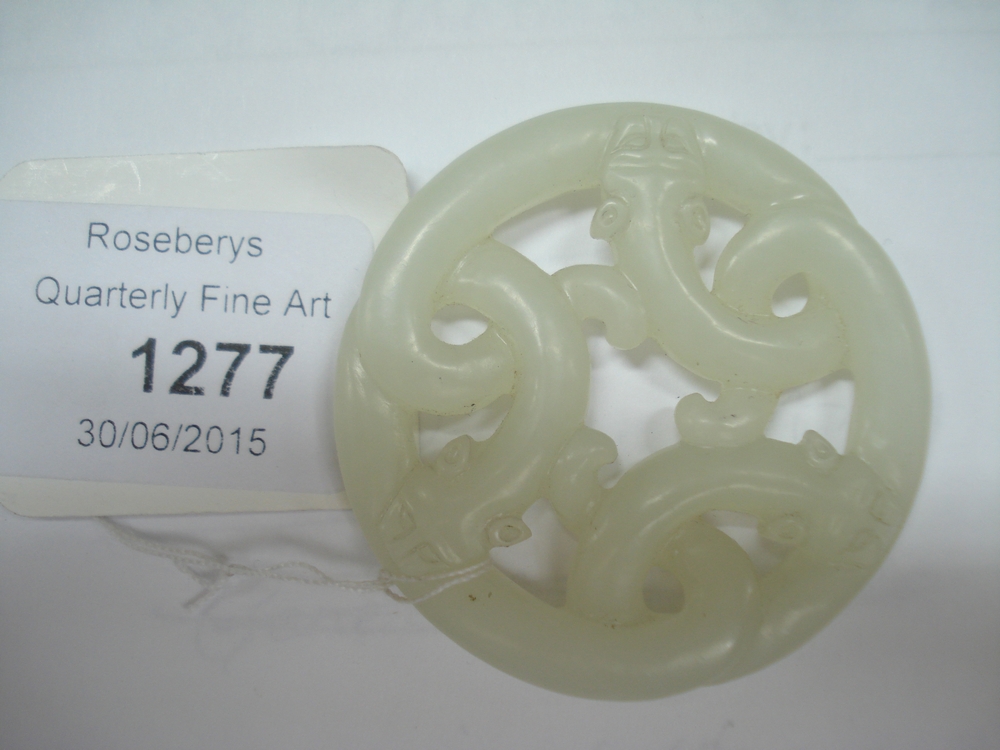 A Chinese carved pale green jade three dragon circular plaque, of pierced and circular form, - Image 2 of 3