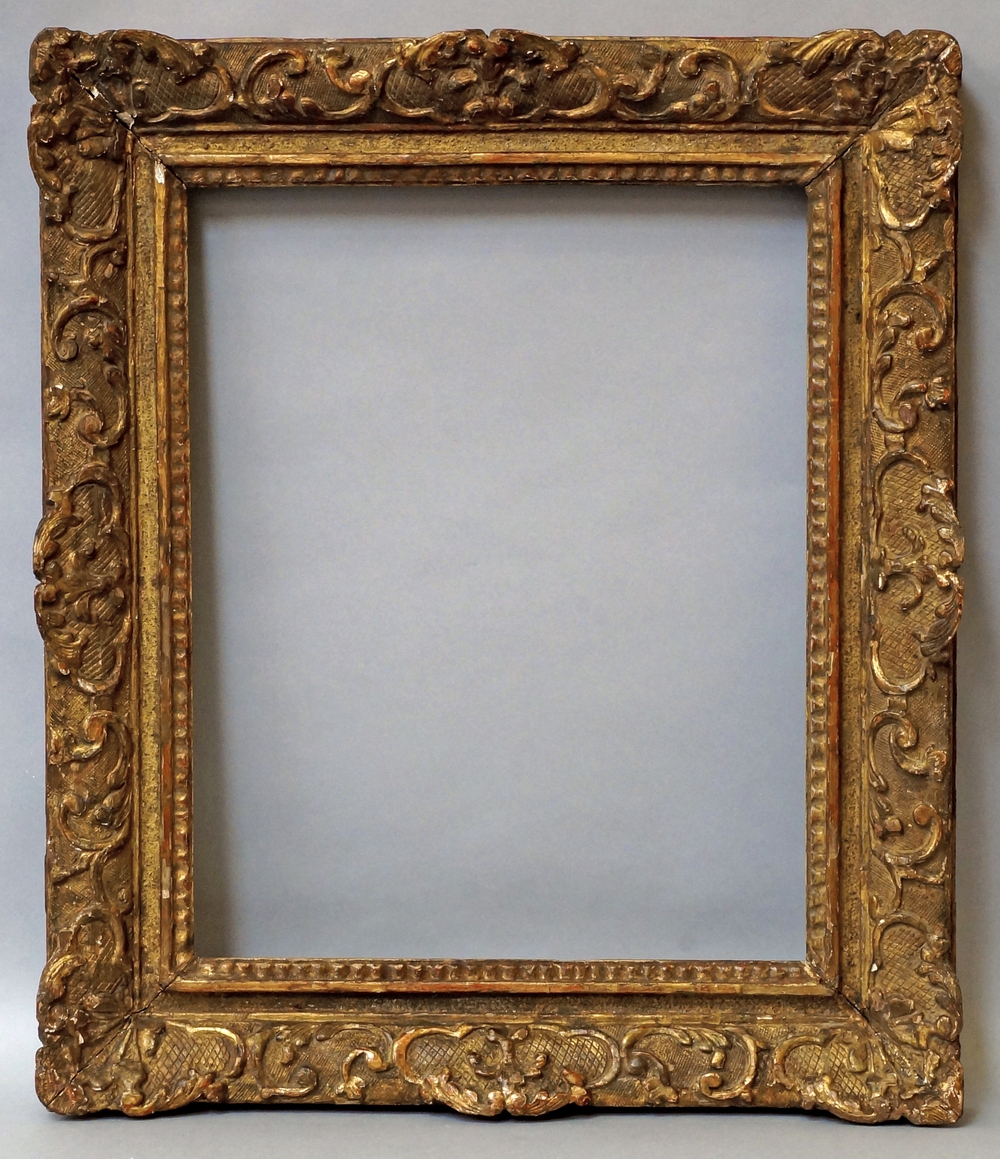 A French Carved and Gilded Louis XIV Style Frame, late 18th/early 19th century,