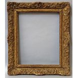 A French Carved and Gilded Louis XIV Style Frame, late 18th/early 19th century,