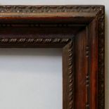 An Italian Carved and Brown Painted Salvator Rosa Frame, 18th century, with cavetto sight,