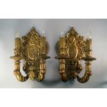 A pair of French giltwood twin branch wall lights, late 19th/20th century, with foliate carved