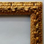 An Italian Carved Emilian Frame, 17th century, with schematic lapped leaf sight,