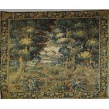 A Flemish tapestry, 17th Century , with trees enclosing a view of a house by a lake, two birds in