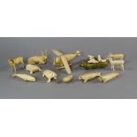 A group of Inuit walrus ivory animals, 20th century, to comprise models of seals, reindeer, whale,