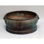 A large Northern European oval copper wine cistern, late 17th/early 18th century, with ring