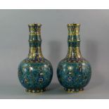 A pair of Chinese cloisonne bottle vases, 19th century, with long collared section necks,