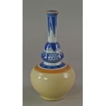 A Chinese bottle vase, in the Kangxi style, the neck with blue and white patterning, on yellow