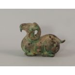 A Chinese bronze model of a ram, in the archaic style, modelled with curling horns,