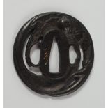 A Japanese tsuba, 18th/19th century, moulded with leaves and gourds, 6.5cm diameter CONDITION