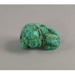 A Chinese turquoise model of a crouching tiger, 20th century, modelled on its haunches,