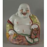 A Chinese porcelain model of Hotei Buddha, 20th century, moulded laughing holding strings of beads,