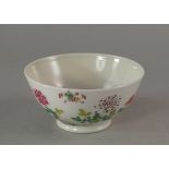 A Chinese porcelain bowl, painted to the exterior with pheasant and rock work,