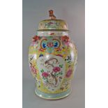 A large Chinese famille rose porcelain jar and cover, 19th century, the lid with lion finial, the