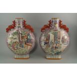 A pair of Chinese moon flasks, 20th century, with pierced archaic style handles, decorated with