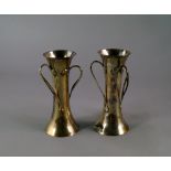 A pair of silver Art Nouveau tri-handled  vases, London c.1901, Sibray, Hall & Co, of waisted