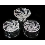 A set of six Baccarat moulded glass comports and matching footed bowl, with swirled hobnail