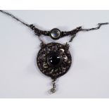 An Arts & Crafts handcrafted unmarked silver pendant, early 20th century, in the style of Arthur and