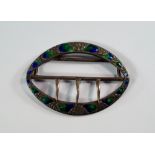 A Liberty & Co. silver and enamel buckle, Birmingham c.1907, of naïveté form, cast water lily