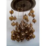 A large and impressive modern designed ceiling light, 20th century, the corona of polished metal,