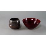 A red glazed studio pottery bowl, of conical form, engraved to base Elsa '79, possibly Elsa Rady,