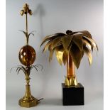 A brass and composite lamp base, 20th century, the column formed of an amber form egg, between