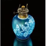 A Web style teal blue cameo glass oil lamp base, of elongated globular form, decorated with a