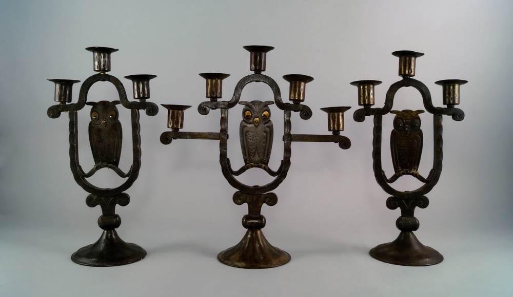 An Arts & Crafts iron and brass five branch 'owl' candelabra, Goberg, Schmalkalden, designed by Hugo