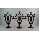 An Arts & Crafts iron and brass five branch 'owl' candelabra, Goberg, Schmalkalden, designed by Hugo