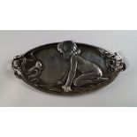 A WMF Art Nouveau pewter tray, cast with a kneeling child studying a snail, stamped to reverse