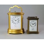 A French brass oval form carriage clock, 20th century,  the white enamel dial with Roman and